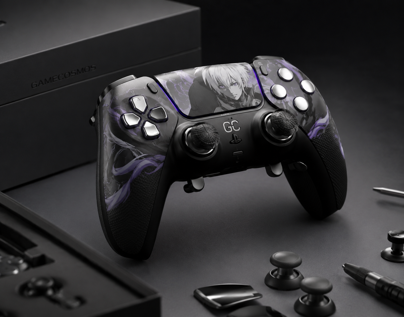 A custom GameCosmos PS5 controller beside its packaging and components